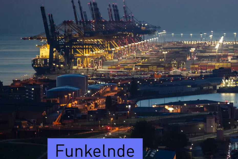 Luftaufnahme des Bremerhavener Hafens bei Nachtanbruch.